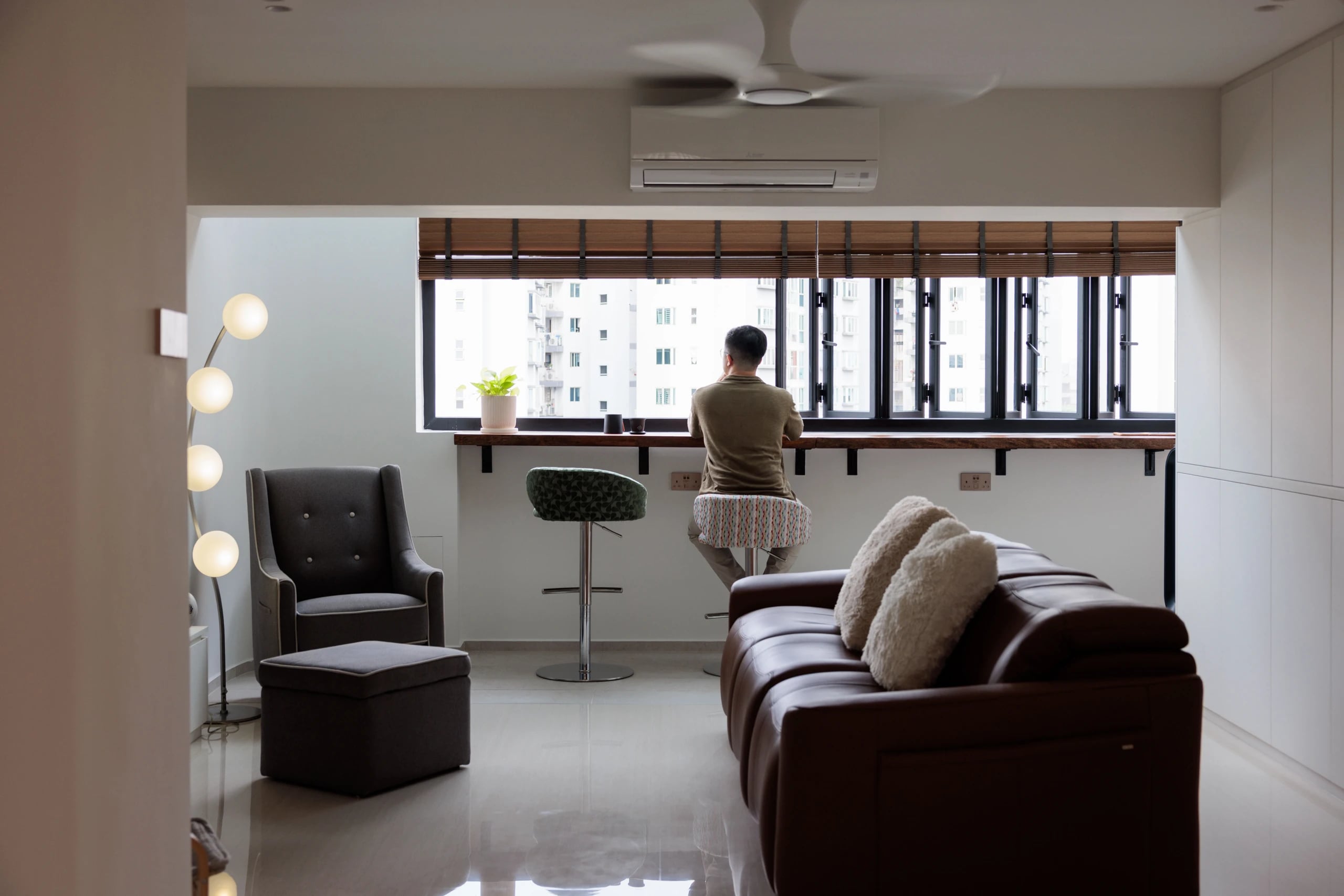 Man sitting at balcony enjoying the view