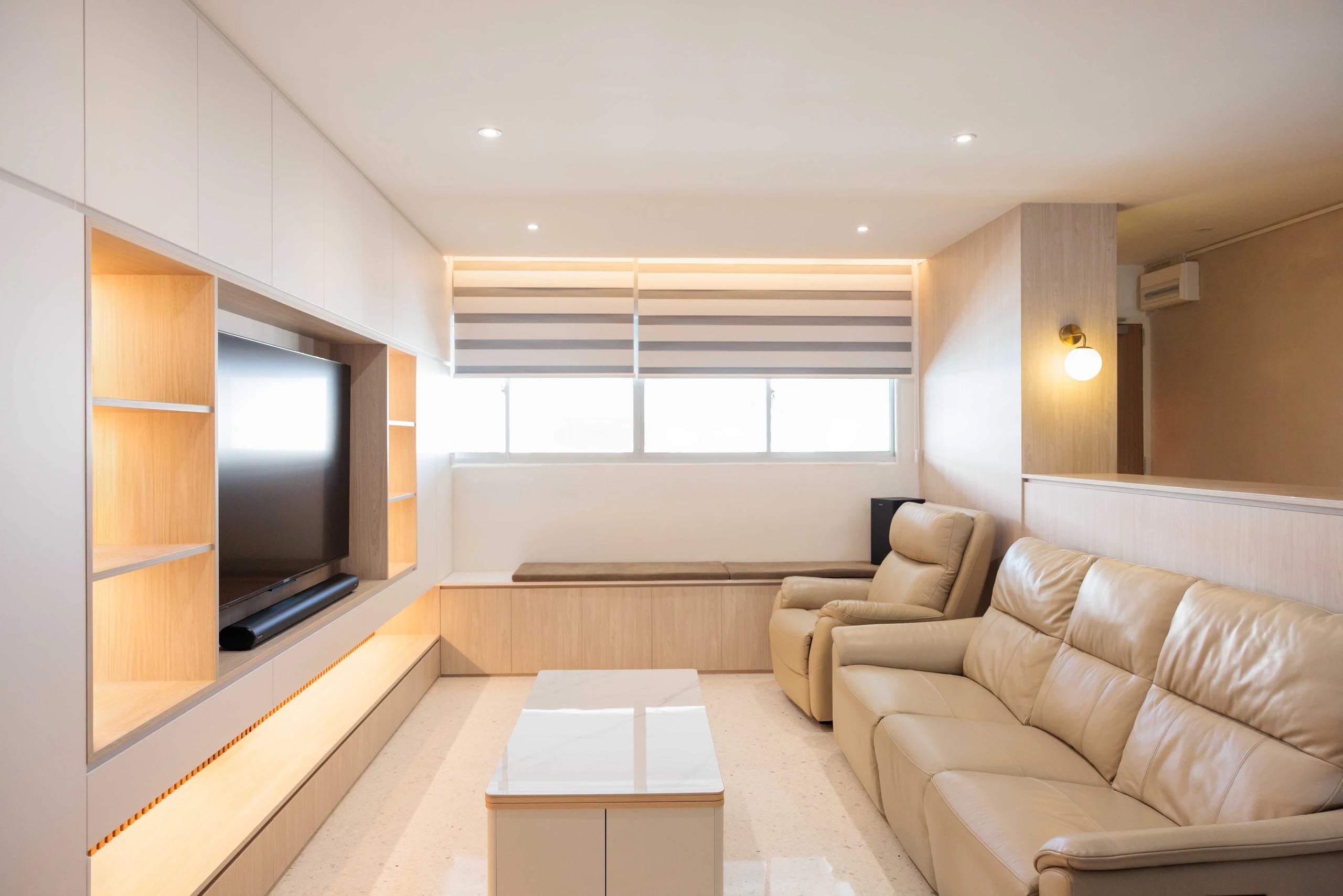 Living room with blinds, sofa, full height cabinets, settee