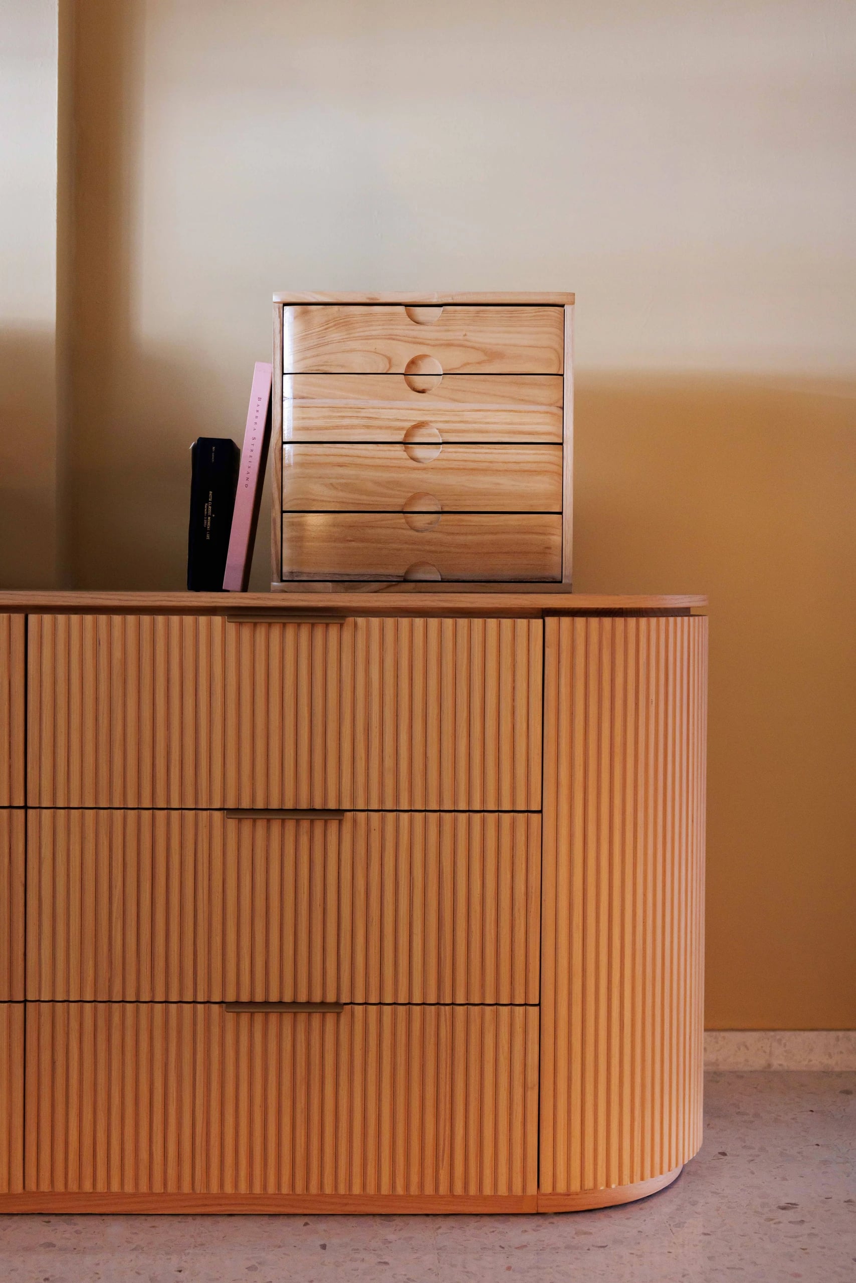 Sideboard with drawer and books