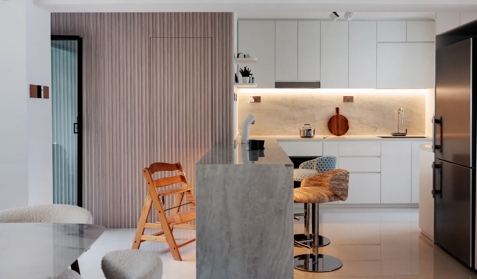 View of concealed door island kitchen
